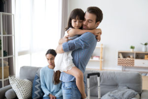 ex husband hugging his daughter