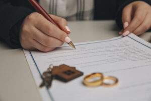 woman signing a divorce
