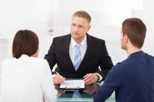 young couple consulting financial advisor